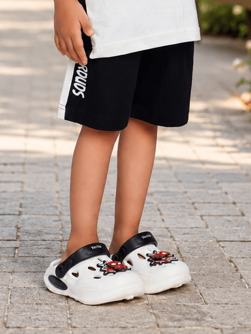 PANDA POP COOL SHORTS FOR BOYS GIRLS BLACK worn with stylish white footwear and a playful design.