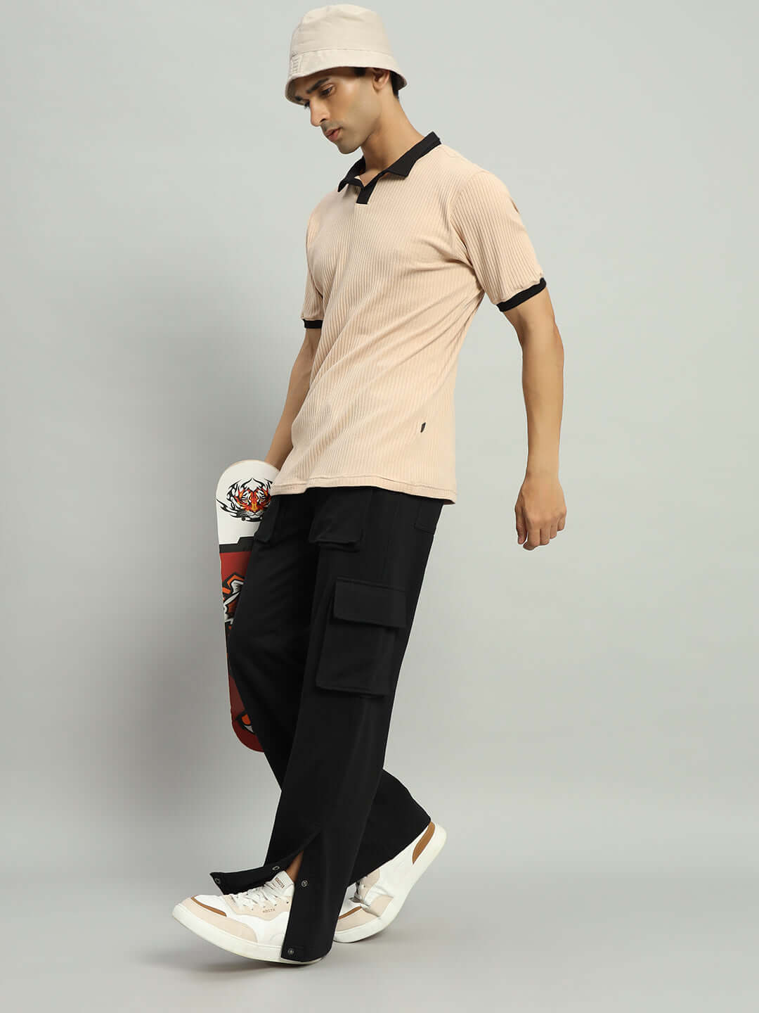 Model wearing BRACE 8 Pocket Cargo Pant in Black, showcasing versatile style with custom fit options.