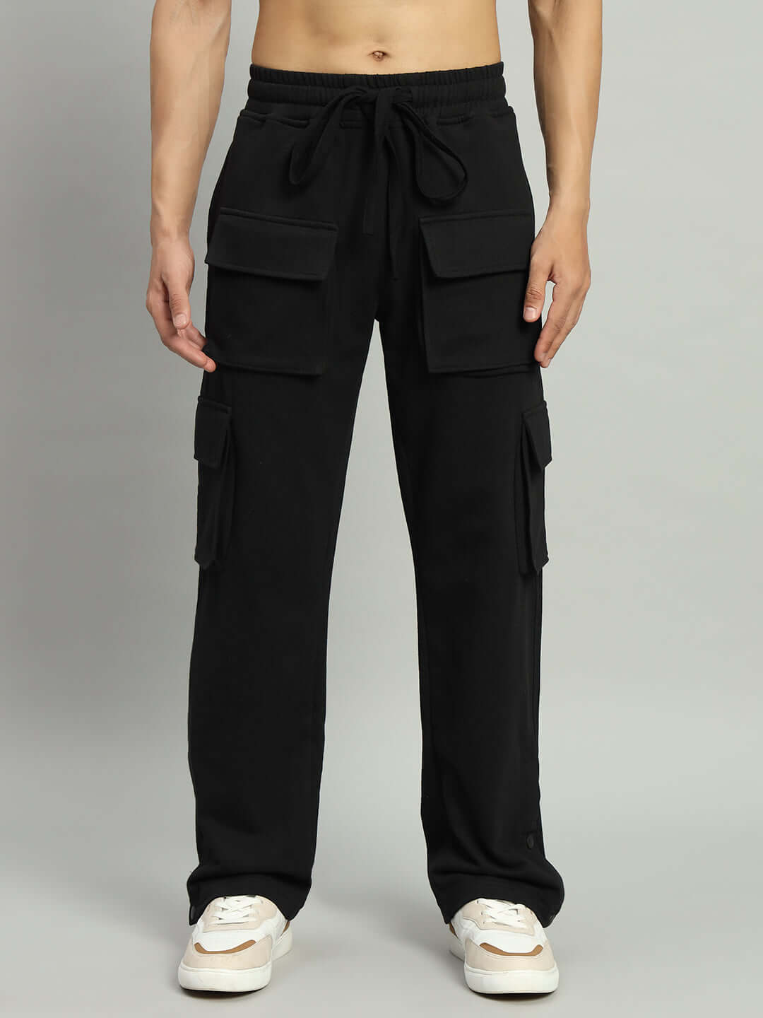 Model wearing black BRACE 8 Pocket Cargo Pant, showcasing adjustable fit, designed by experienced tailors, perfect for custom sizing.