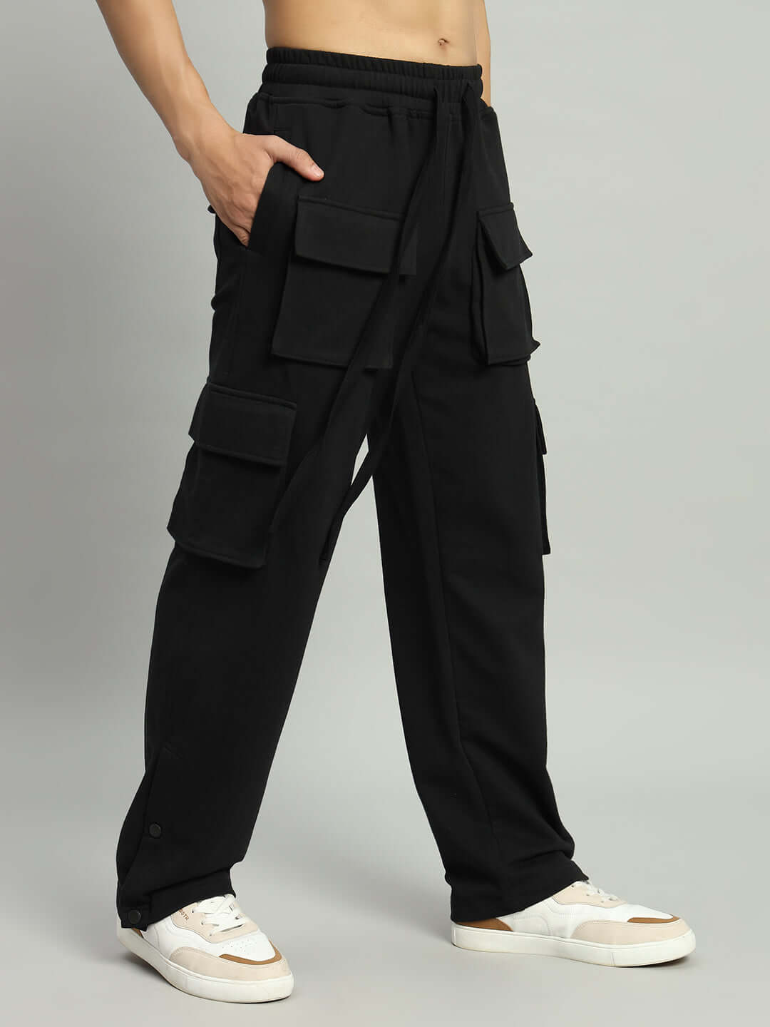 Man wearing BRACE 8 Pocket Cargo Pant in black, featuring multiple pockets, made-to-order by DUDS Tailors, available in custom fit.