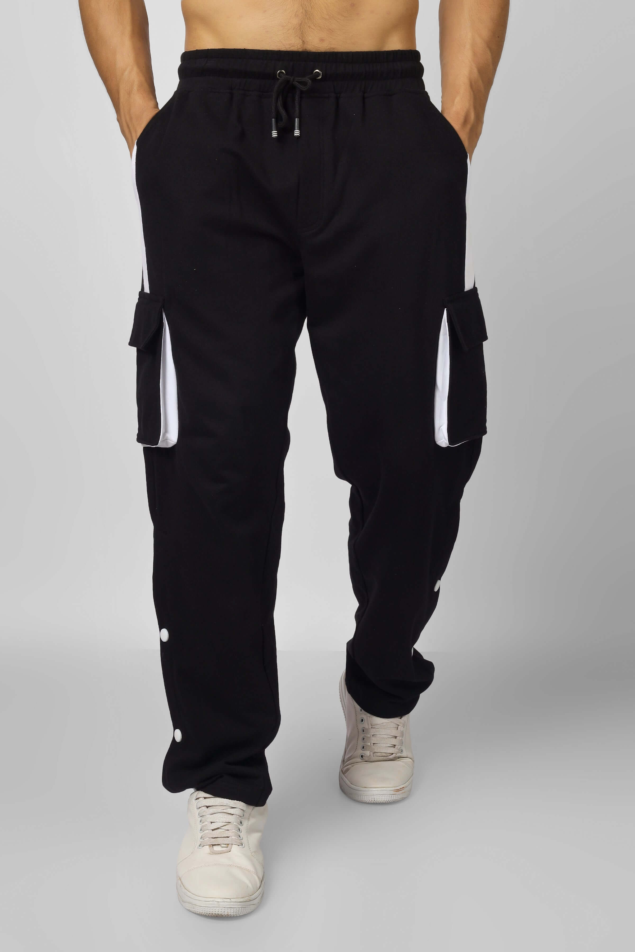 Alt Tag: Model wearing black and white highlighter bracket cargo pants with pockets, custom fit option available.