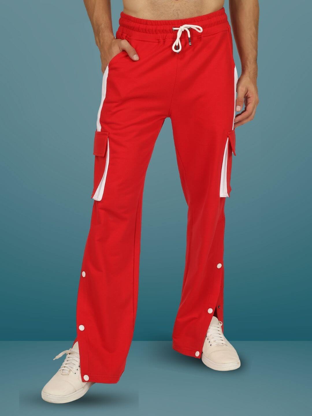 Red and white highlighter cargo pants featuring a customizable fit, designed by DUDS, shown on a male model with white sneakers.
