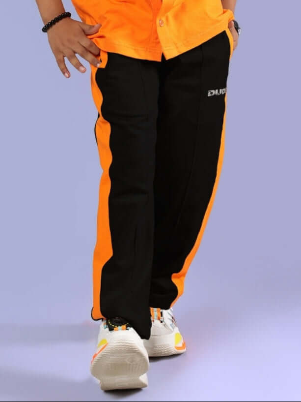 Breezer Jogger for Boys and Girls in Black-Orange, featuring customizable fit by DUDS Fashion, front view with orange side stripes.