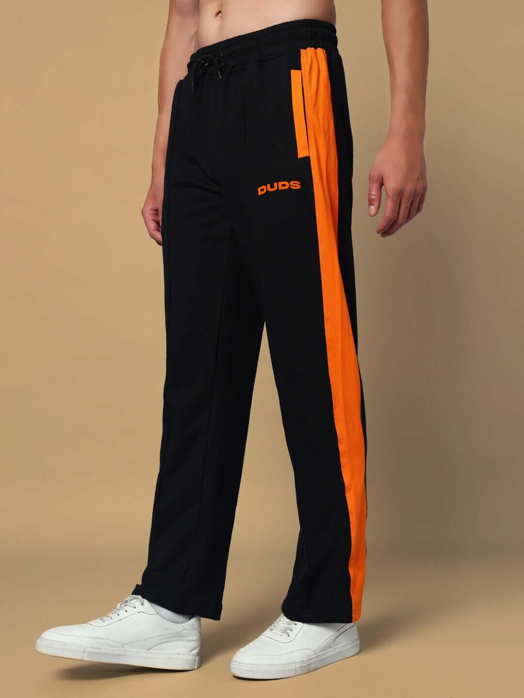 Breezer Side Contrast Joggers in Black-Orange by DUDS with custom fit option available, worn by model standing against neutral background.