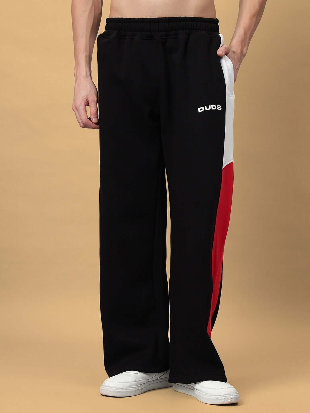 BRIO FLEECE COLORBLOCK CO-ORD BLACK pants with colorblock design, featuring black base and contrasting red and white panels.
