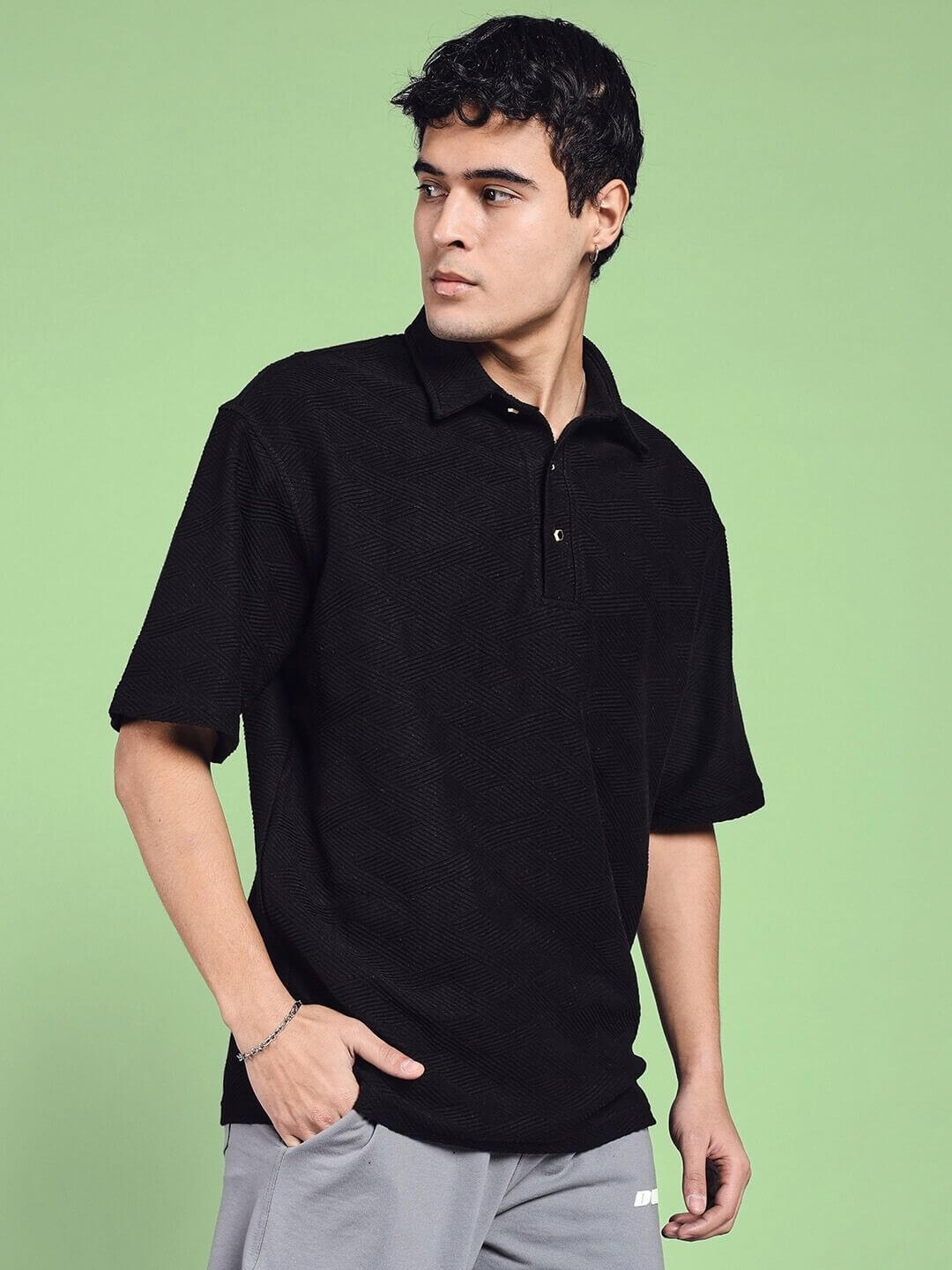 Man wearing BROCADE POLO COTTON T-SHIRT BLACK with a stylish design and comfortable fit.