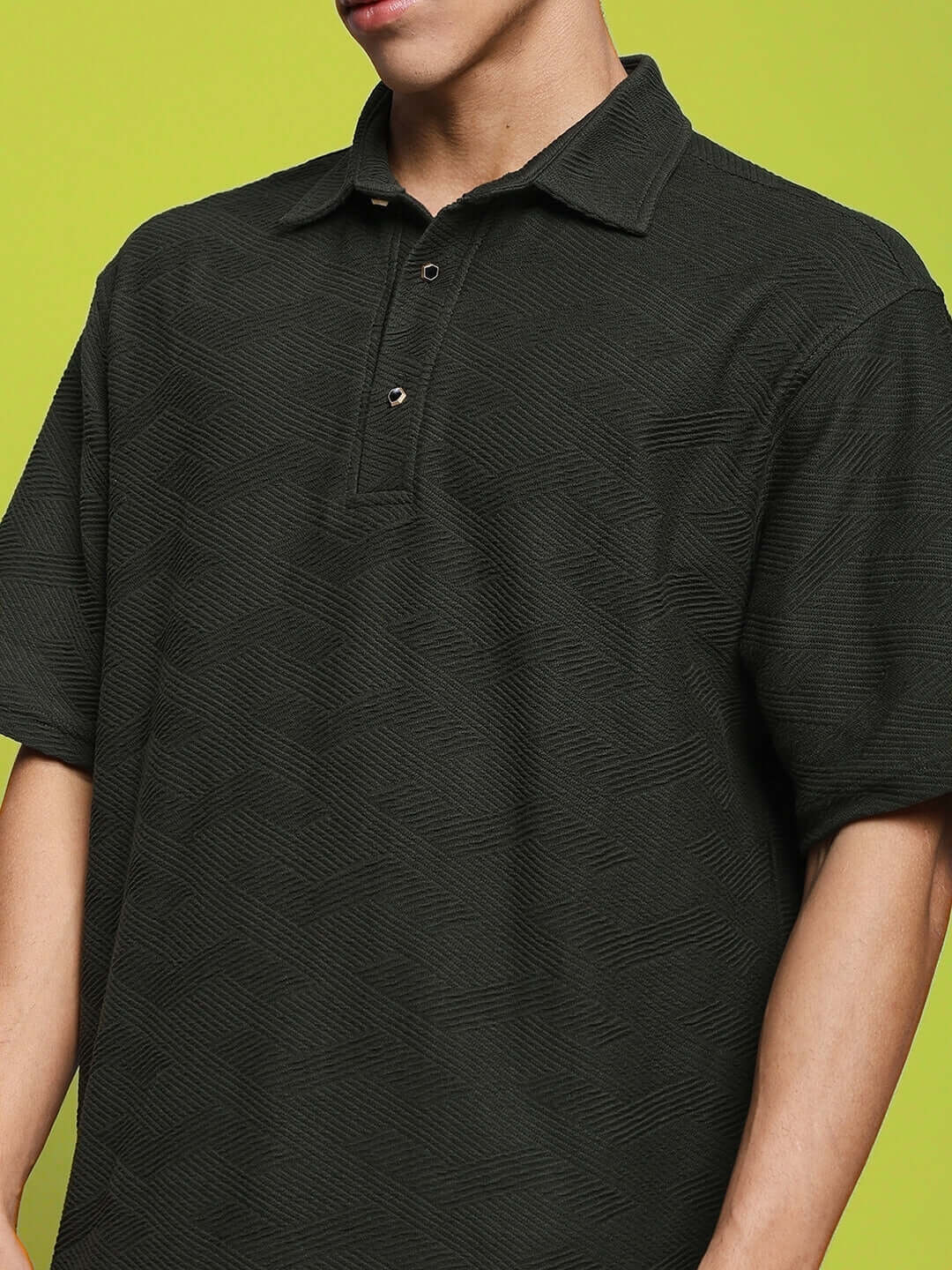 Dark green brocade polo t-shirt in cotton jacquard fabric, half sleeves, modeled by 6-foot tall individual, suitable for everyday wear.