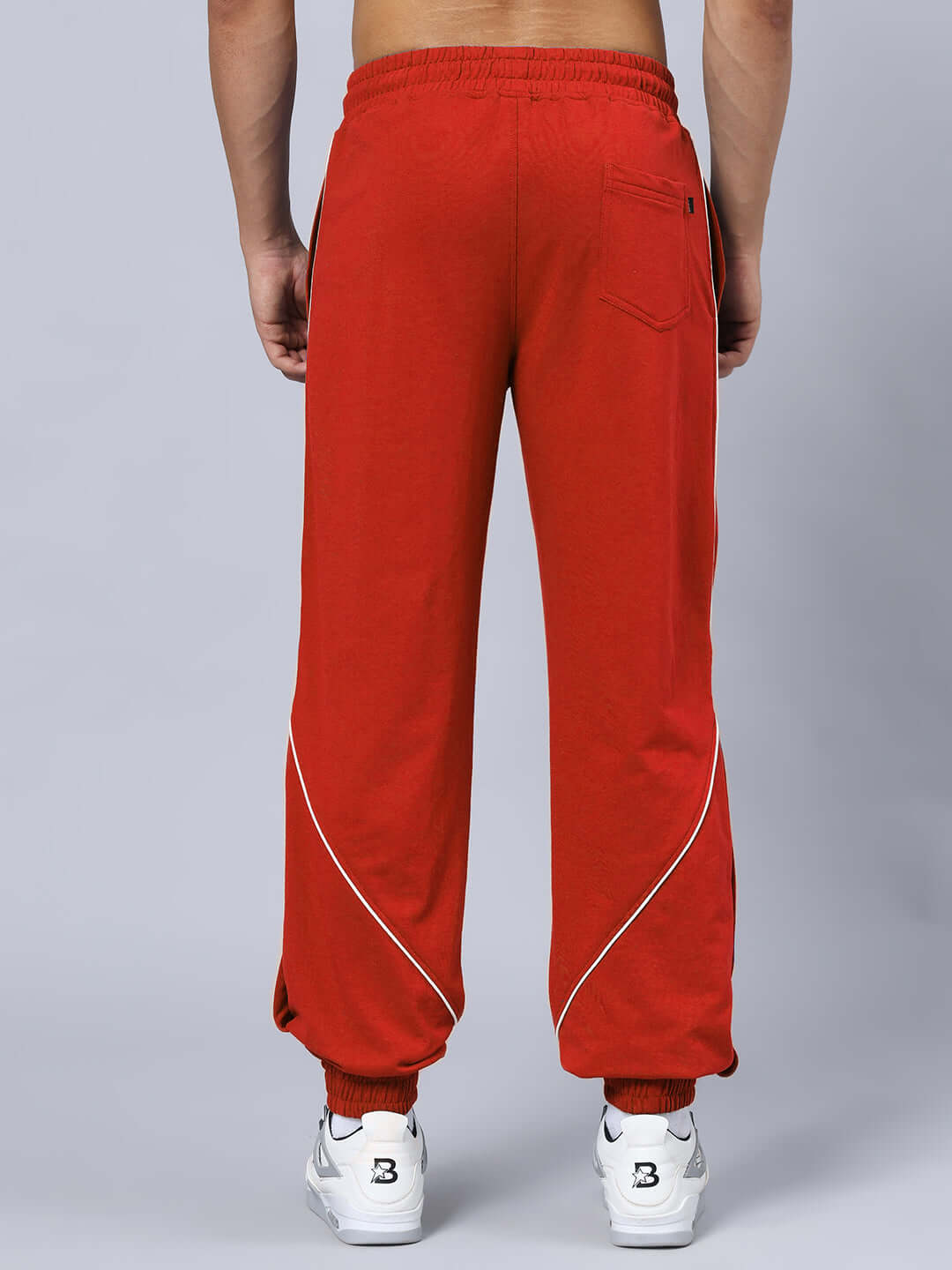 Red BROSSFINE contrast joggers with white trim, shown from the back, tailored by experienced tailors, customizable sizes available.
