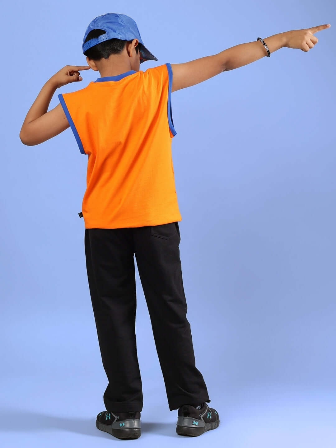 Child wearing BUFFY CO-ORD FOR BOYS & GIRLS ORANGE BLACK with vibrant design, showcasing custom fit option. Ideal for kids' fashion.