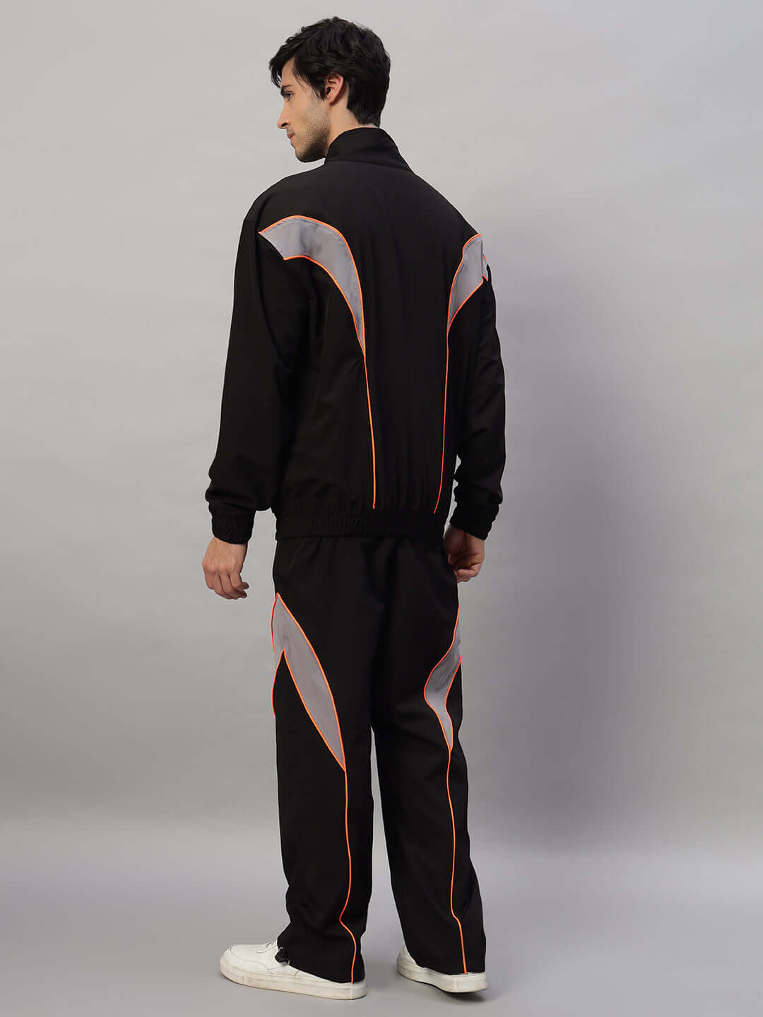 Model wearing BULLET OVERSIZED CO-ORD SET BLACK, showcasing a stylish streetwear look with a bold oversized design, back view.