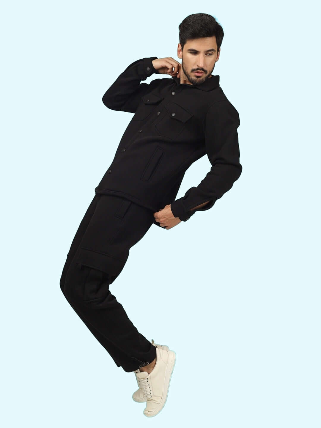 Model wearing Burly Black overshirt and cargo pant co-ord set, showcasing stylish casualwear with white sneakers.