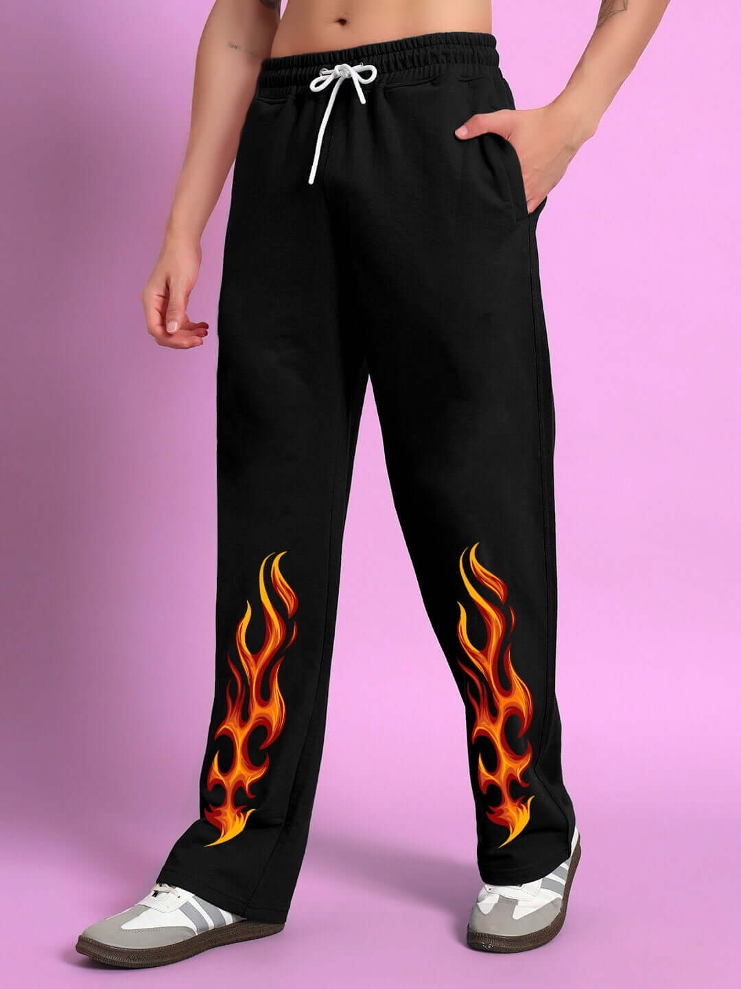 Black jogger pants with fiery flame print on legs, made to order by DUDS, offering custom fit for prepaid orders.