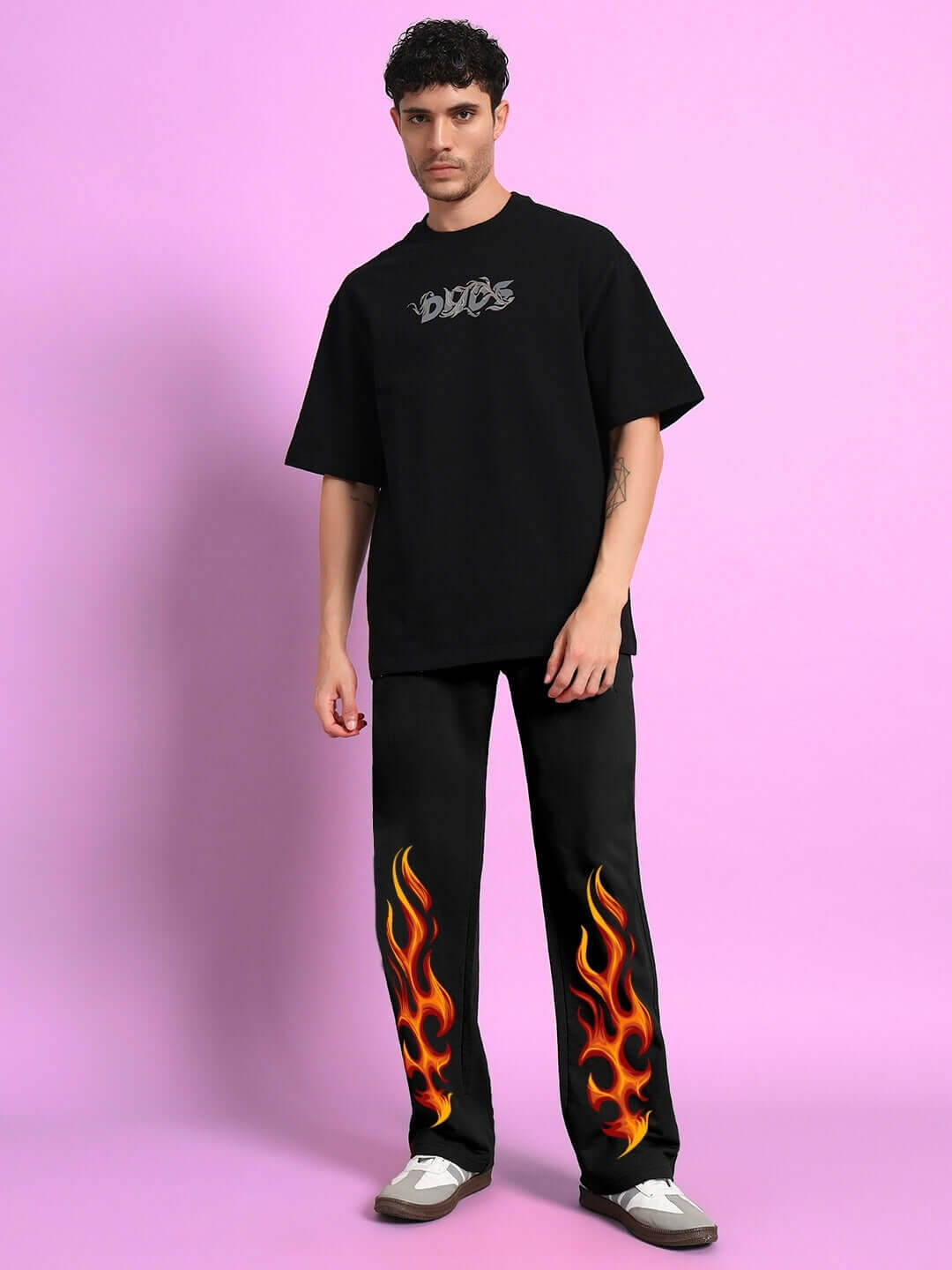 Model wearing Burning Fire Jogger in black with flame design, tailored by DUDS. Custom fit option available for prepaid orders.