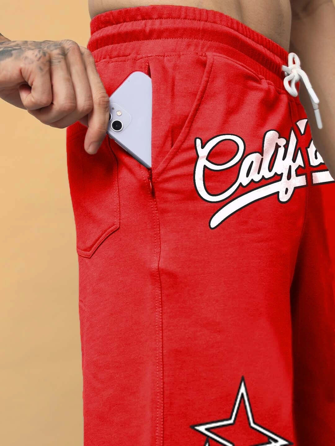 Red California regular fit shorts with phone in pocket, featuring a star design and white drawstring, ideal for custom fit options.