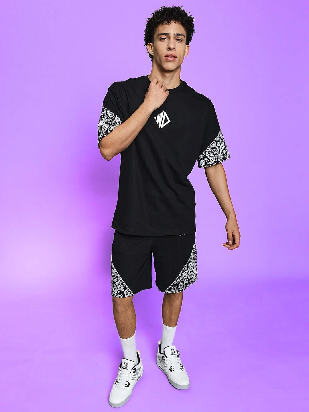 Model wearing CALVIN CO-ORD SET in black with intricate sleeve patterns, made from premium cotton French terry lycra, perfect for stylish comfort.
