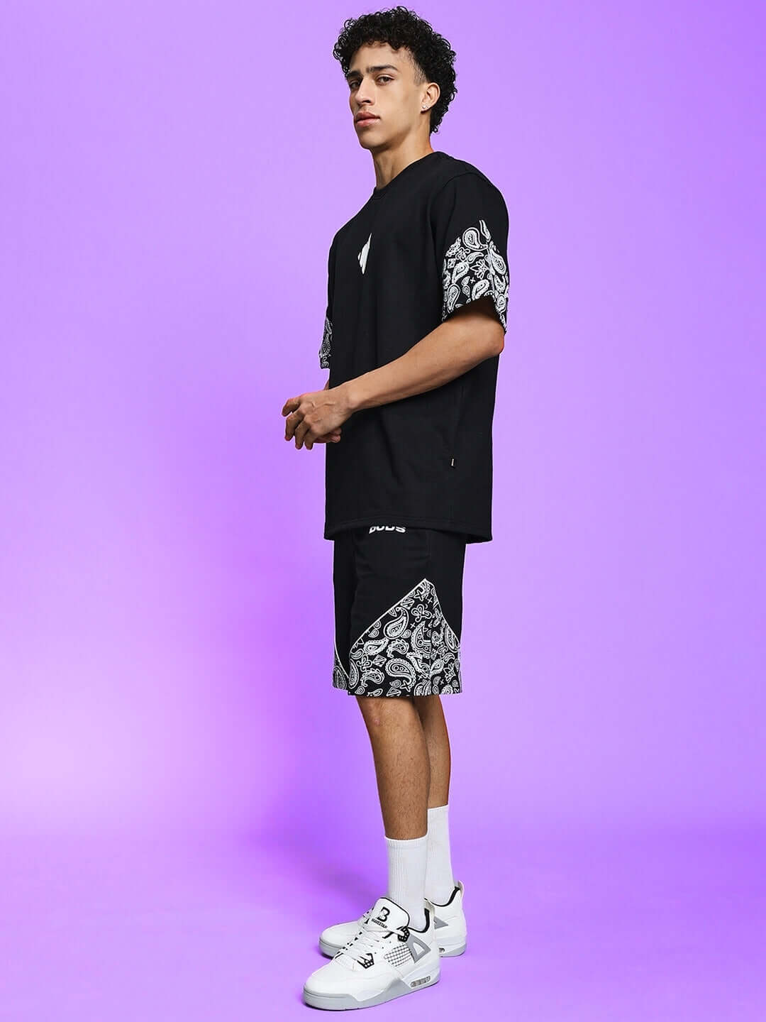 Man wearing CALVIN CO-ORD SET in black with patterned accents, made of premium cotton French Terry Lycra, perfect for a stylish casual look.