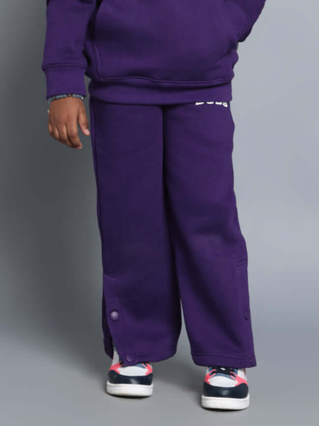 Child wearing CASPER FLEECE PANT FOR BOYS GIRLS PURPLE showcasing style and comfort.