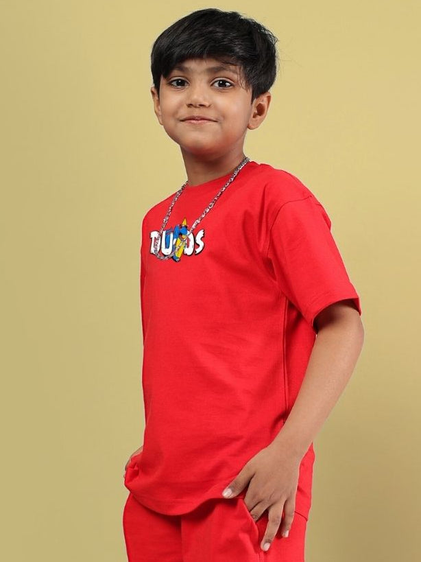 CATCH THE WAVES T-SHIRT FOR BOYS GIRLS RED worn by a child, showcasing the bold red color and casual style, perfect for adventurous kids.