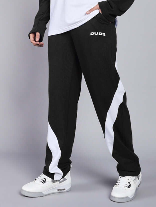 Model wearing Celestine Cool Relaxed Fit Jogger in black and white by DUDS, showcasing comfortable waistband and stylish design.
