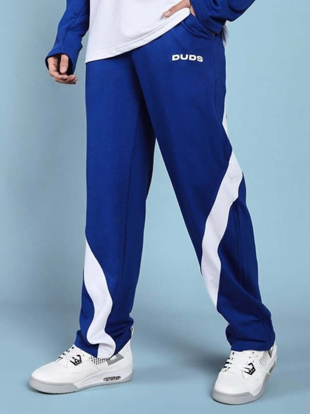 Model wearing Celestine Cool Relaxed Fit Jogger in blue and white, featuring DUDS branding, ideal for casual and laid-back styles.