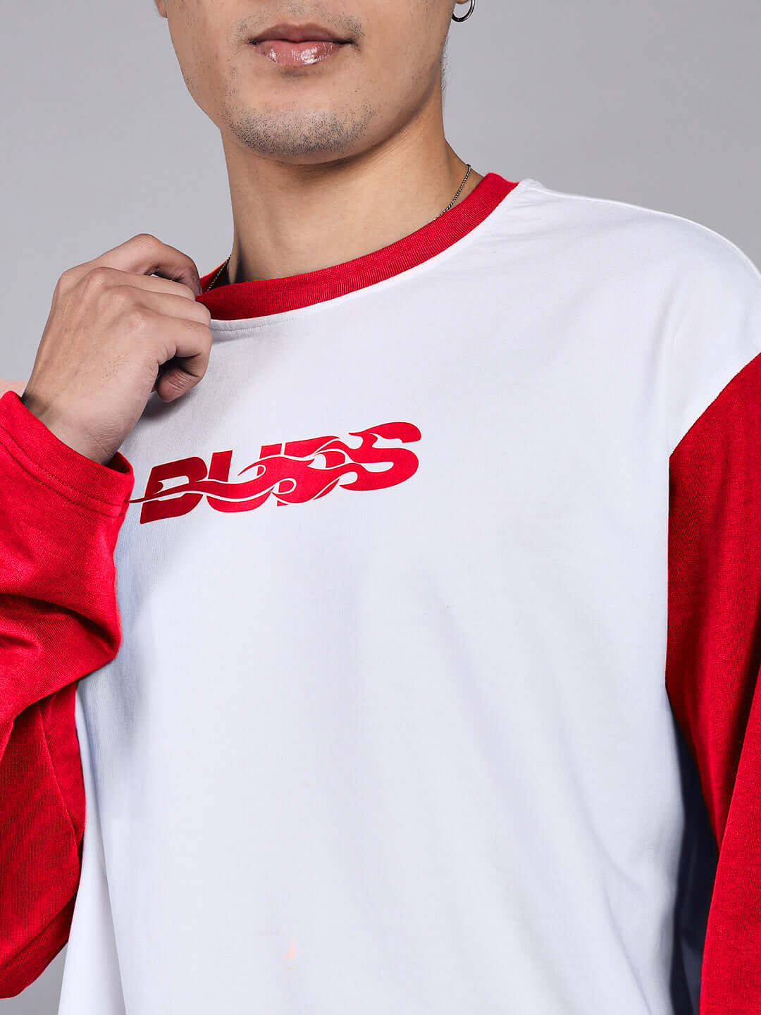 Model wearing CELESTINE COOL SWEATSHIRT in white and red, made from 97% premium cotton and 3% elastane, featuring a bold front design.