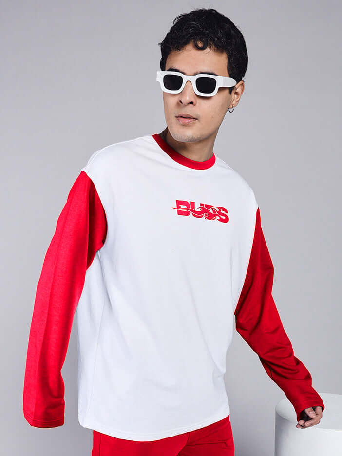 Man wearing Celestine Cool Sweatshirt in white and red with graphic text, styled with sunglasses. Made from premium cotton with bio-washed finish.