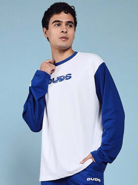 Model wearing Celestine Cool Sweatshirt in white and blue, made from 97% premium cotton French Terry Lycra, styled for casual wear.