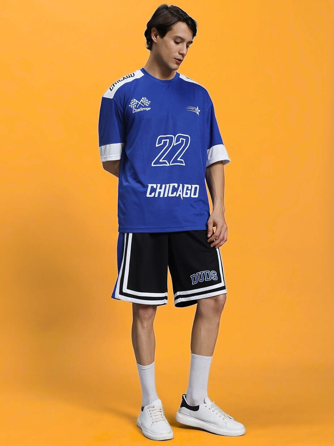 Child wearing CHALLENGE COLORBLOCK CO-ORD SET ROYAL BLUE activewear with number 22 top and shorts.