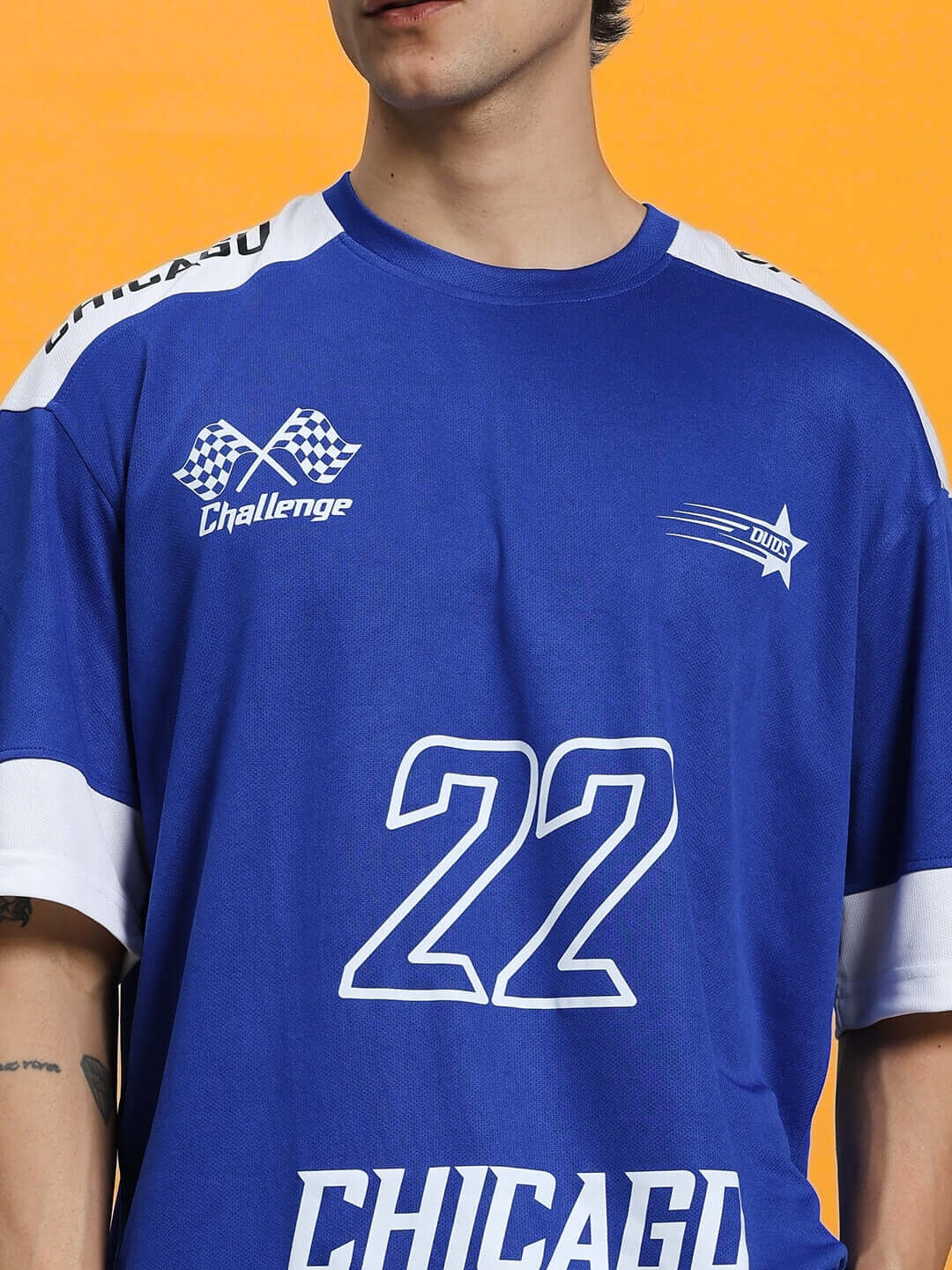 Model wearing CHALLENGE COLORBLOCK CO-ORD SET ROYAL BLUE top with number 22 print, showcasing bold style and comfort.