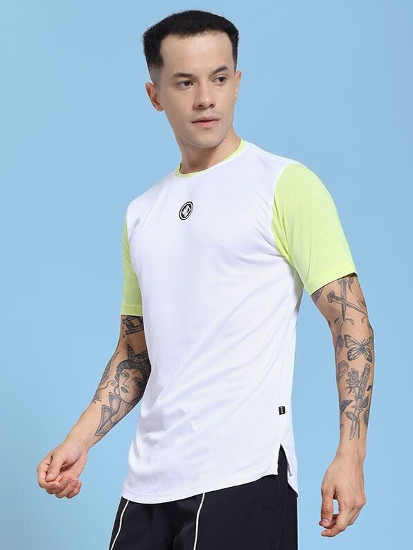 Man wearing CHAMPION ZONE REGULAR FIT T-SHIRT WHITE NEON GREEN against blue background