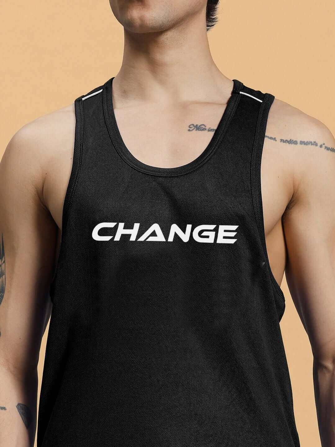 Person wearing the CHANGE YOUR LOOKS GYM CO-ORD SET BLACK tank top, showcasing modern fitness style and functionality.