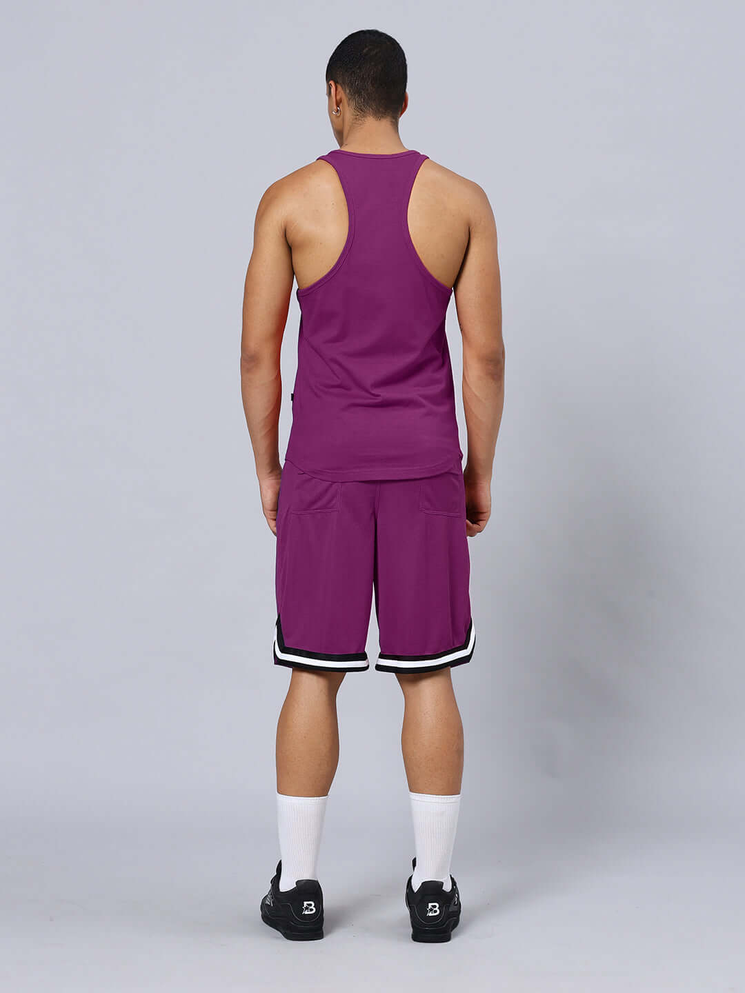 Back view of CHASING BLESS PRINTED GYM CO-ORD SET PURPLE outfit showcasing design and fit.