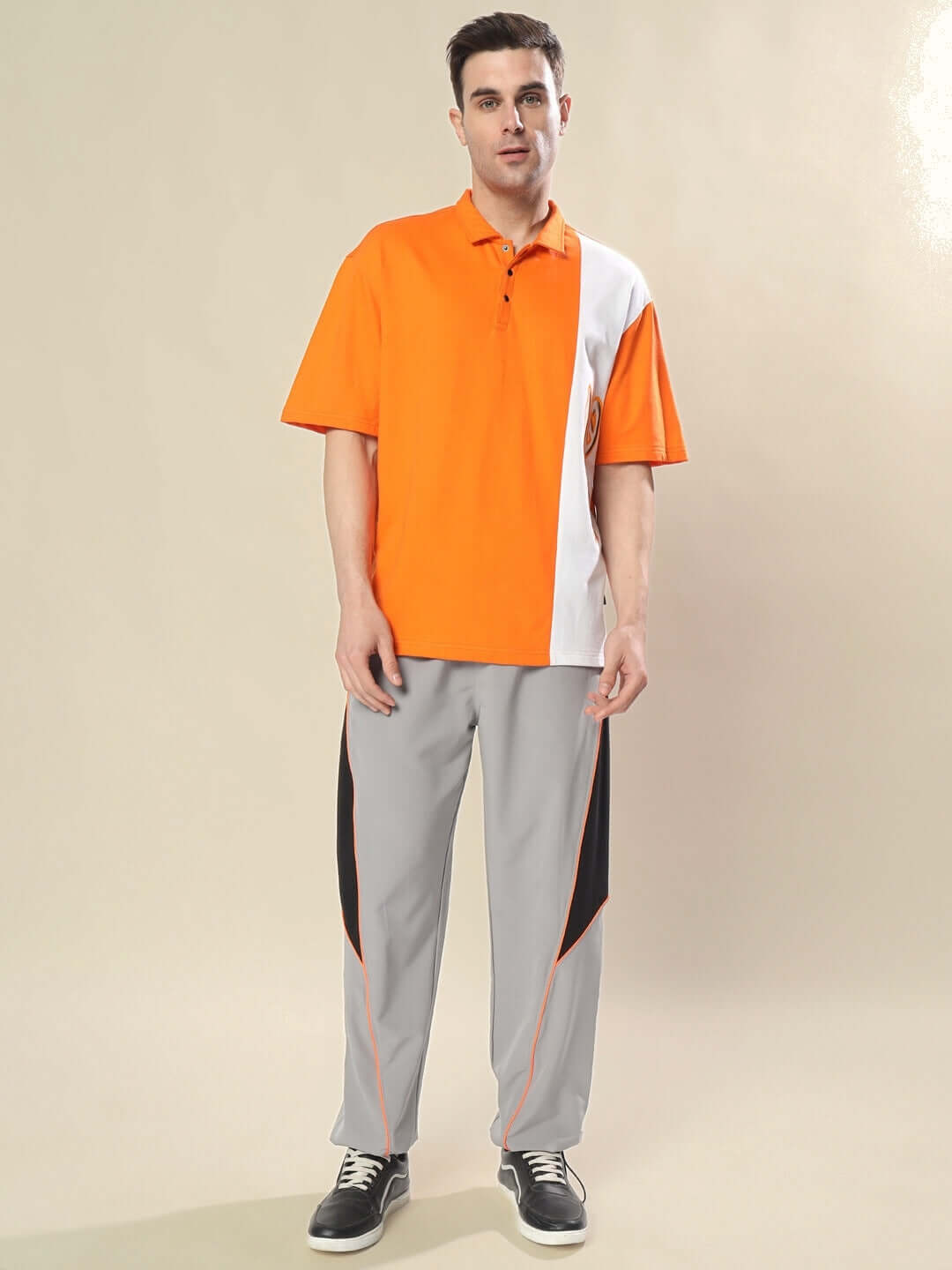 Model wearing CHEUGY Oversized Polo T-Shirt in orange-white, made of premium cotton French terry fabric, stylish and comfortable fashion.