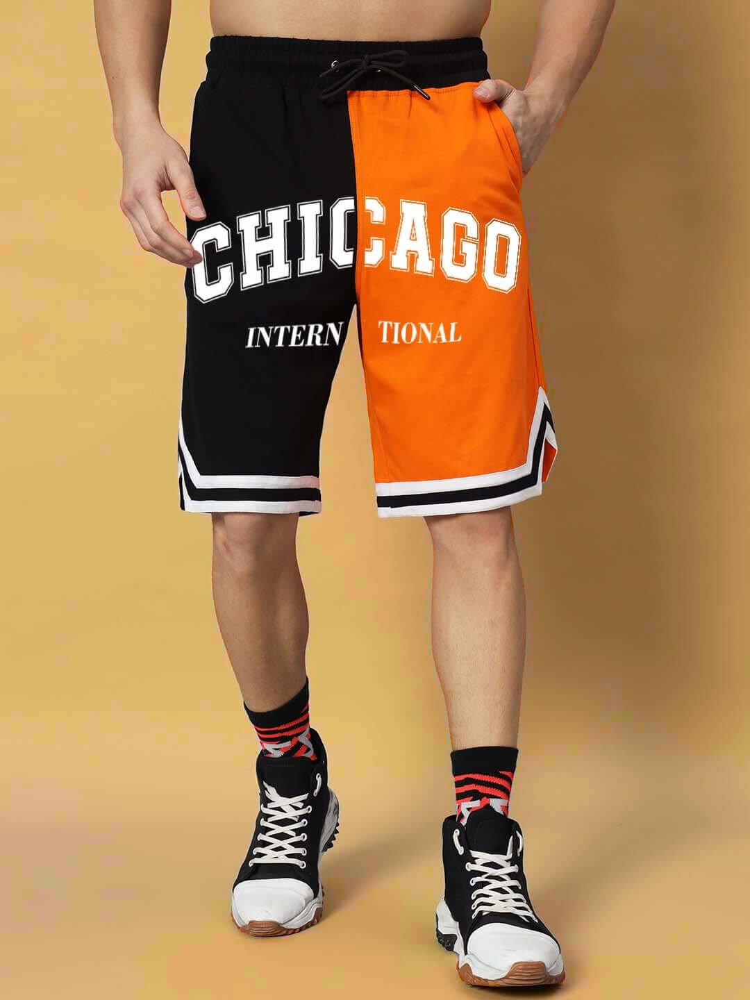 Chicago regular fit shorts in orange-black with customizable size option, featuring bold lettering and sporty design.