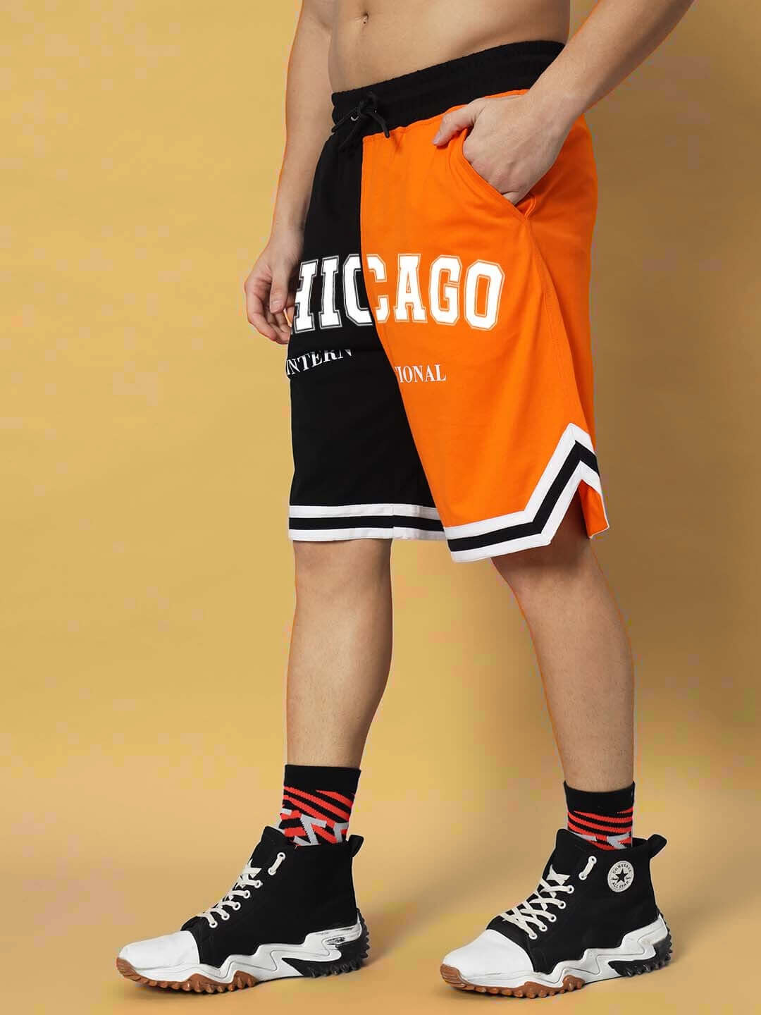 Chicago Regular Fit Shorts in orange-black, highlighted with contrasting details. Features a bold Chicago print and comfortable fit.