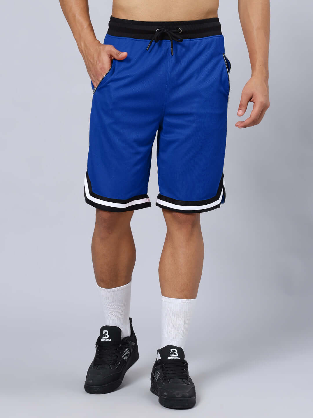 Model wearing blue Chronic Regular Fit Shorts with drawstring waist and side pockets.