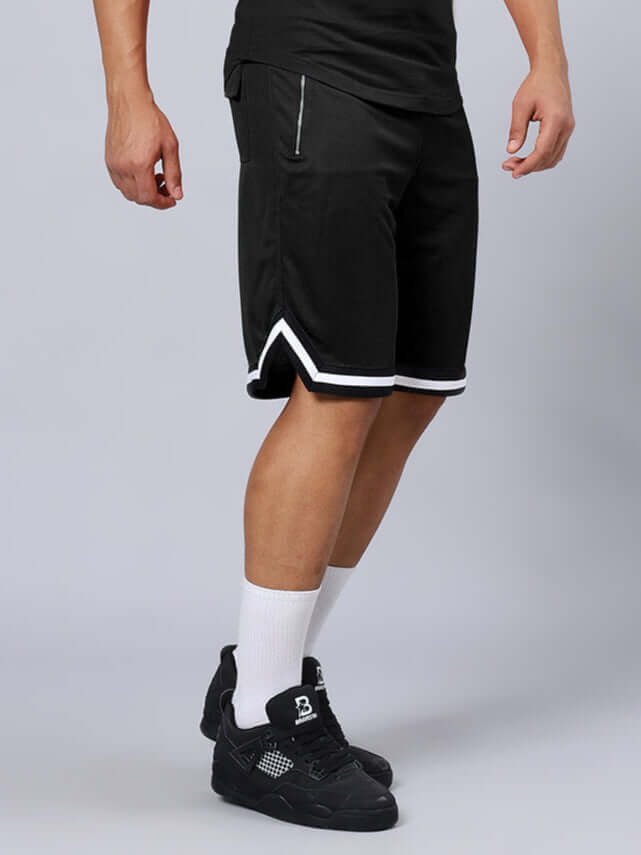 CHRONIC REGULAR FIT SHORTS BLACK worn by a model, showcasing custom fit, available for prepaid orders, top view highlighting design details.