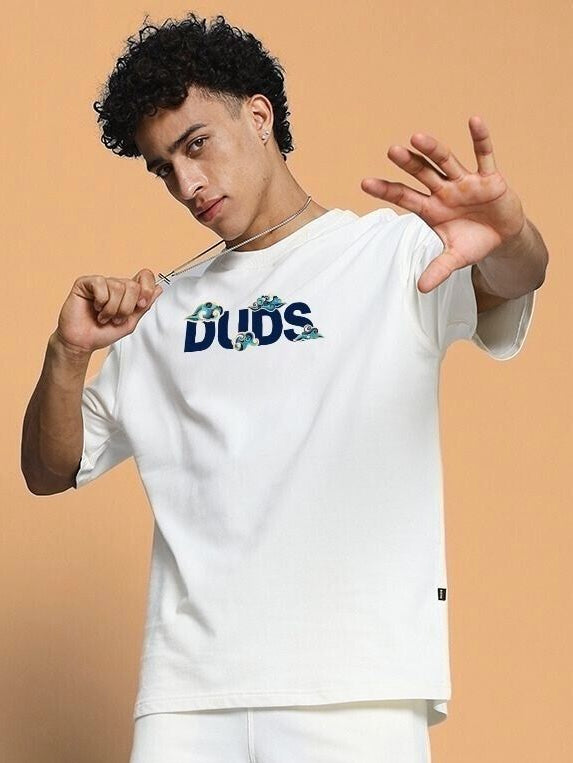 Model wearing the CLOUD PRINTED OVERSIZED T-SHIRT OFF WHITE with a stylish cloud design and relaxed fit for a trendy look.