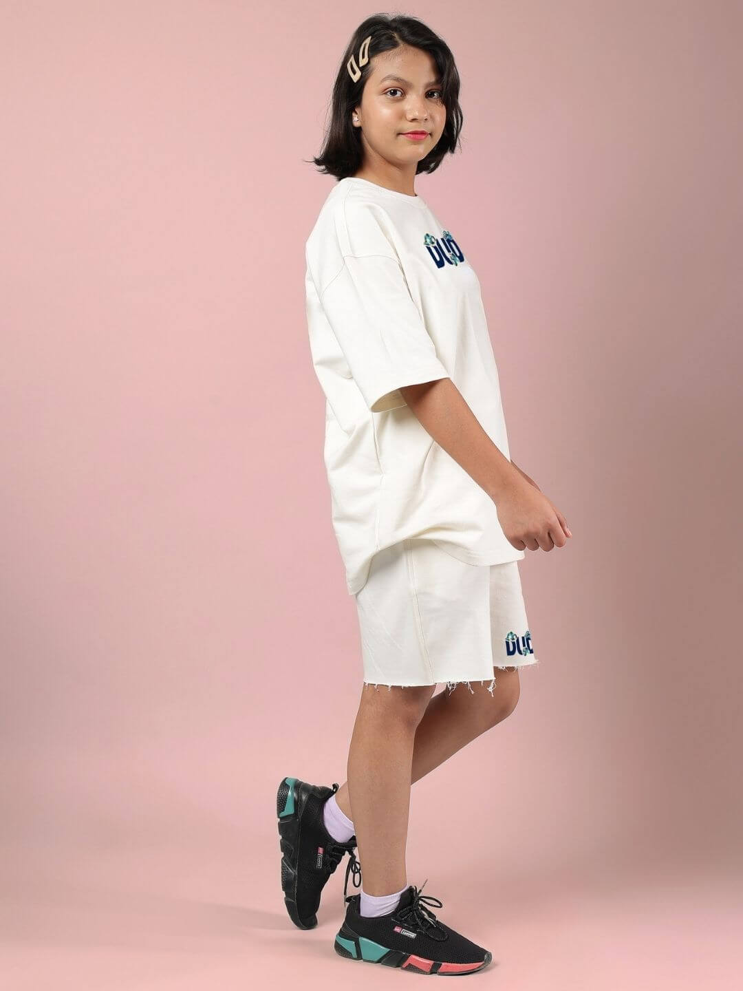 Child wearing CLOUD PRINTED CO-ORD FOR BOYS AND GIRLS OFF WHITE, featuring breathable cotton fabric with playful cloud prints for stylish comfort.