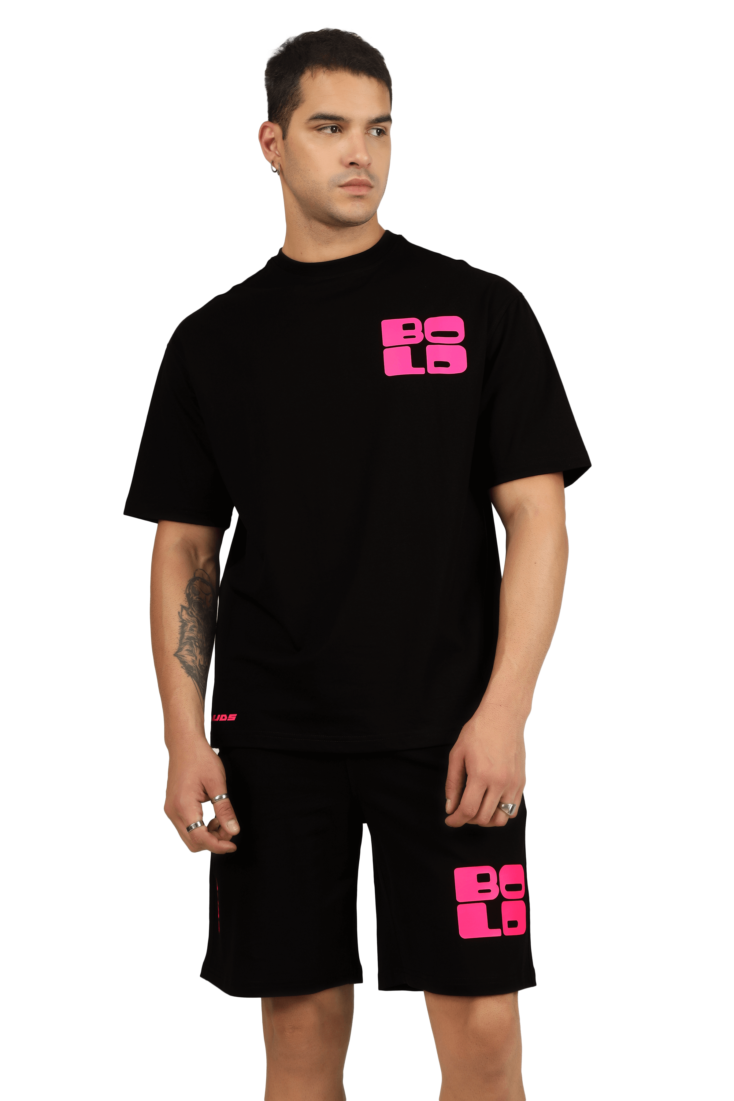Person wearing a black CO-ORD set with bold pink print, featuring a T-shirt and shorts. Custom fit option available.