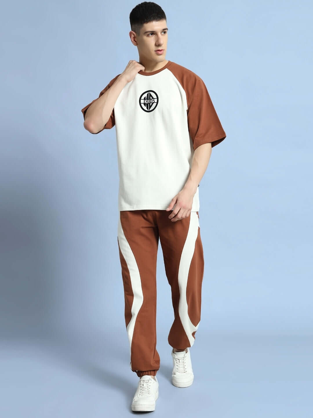 Model wearing COCOA CO-ORD SET in off white-brown, made from premium cotton and elastane, shown against a light blue background.