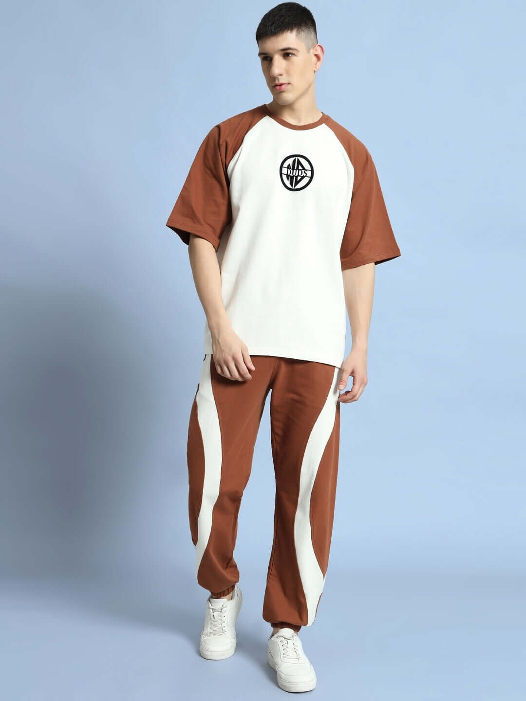 Model wearing Cocoa Co-ord Set in off white and brown, made of premium cotton French terry lycra, featuring short sleeves and relaxed fit.