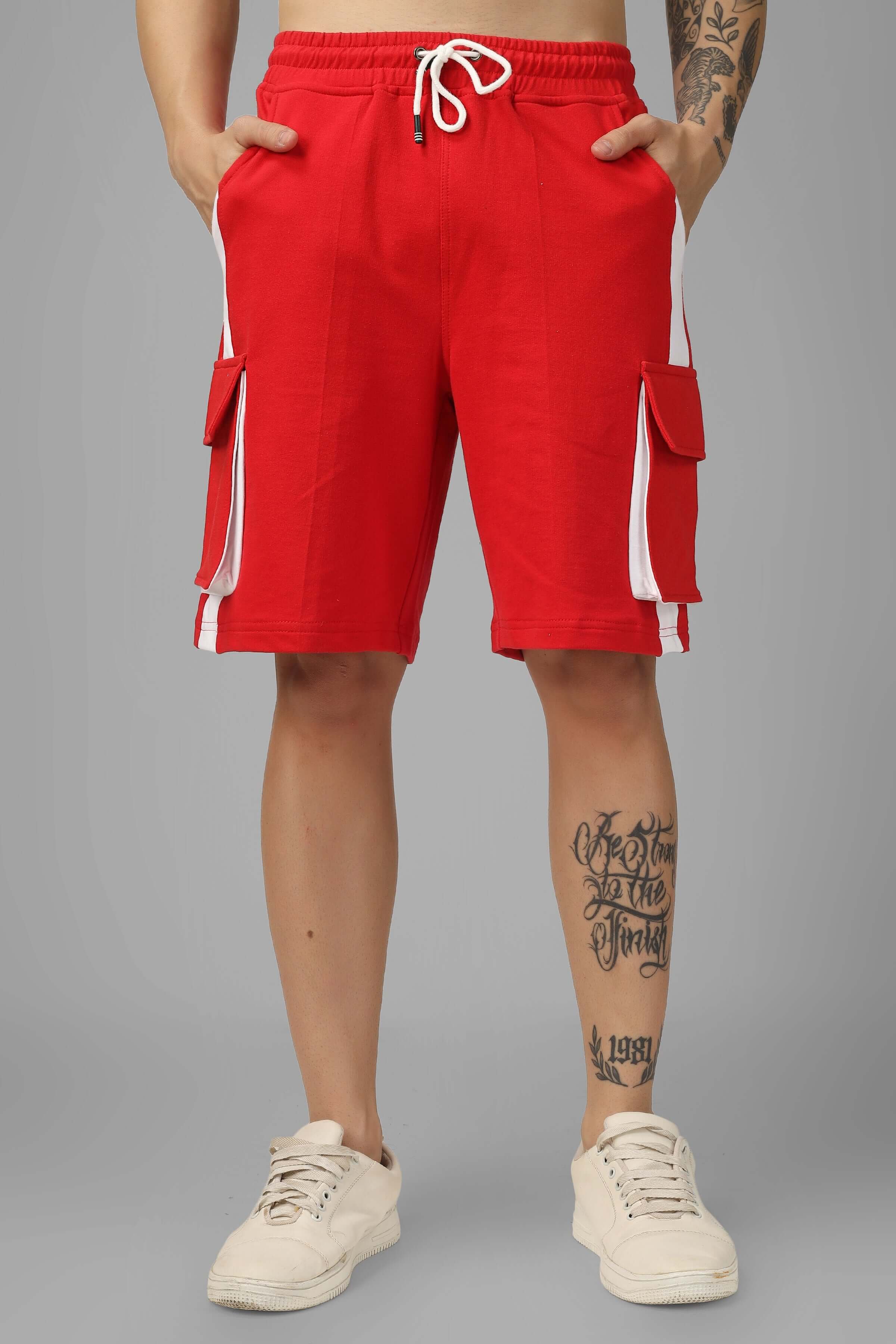 Model wearing CONTRA regular fit red and white cargo shorts, featuring deep pockets, customizable fit option available.
