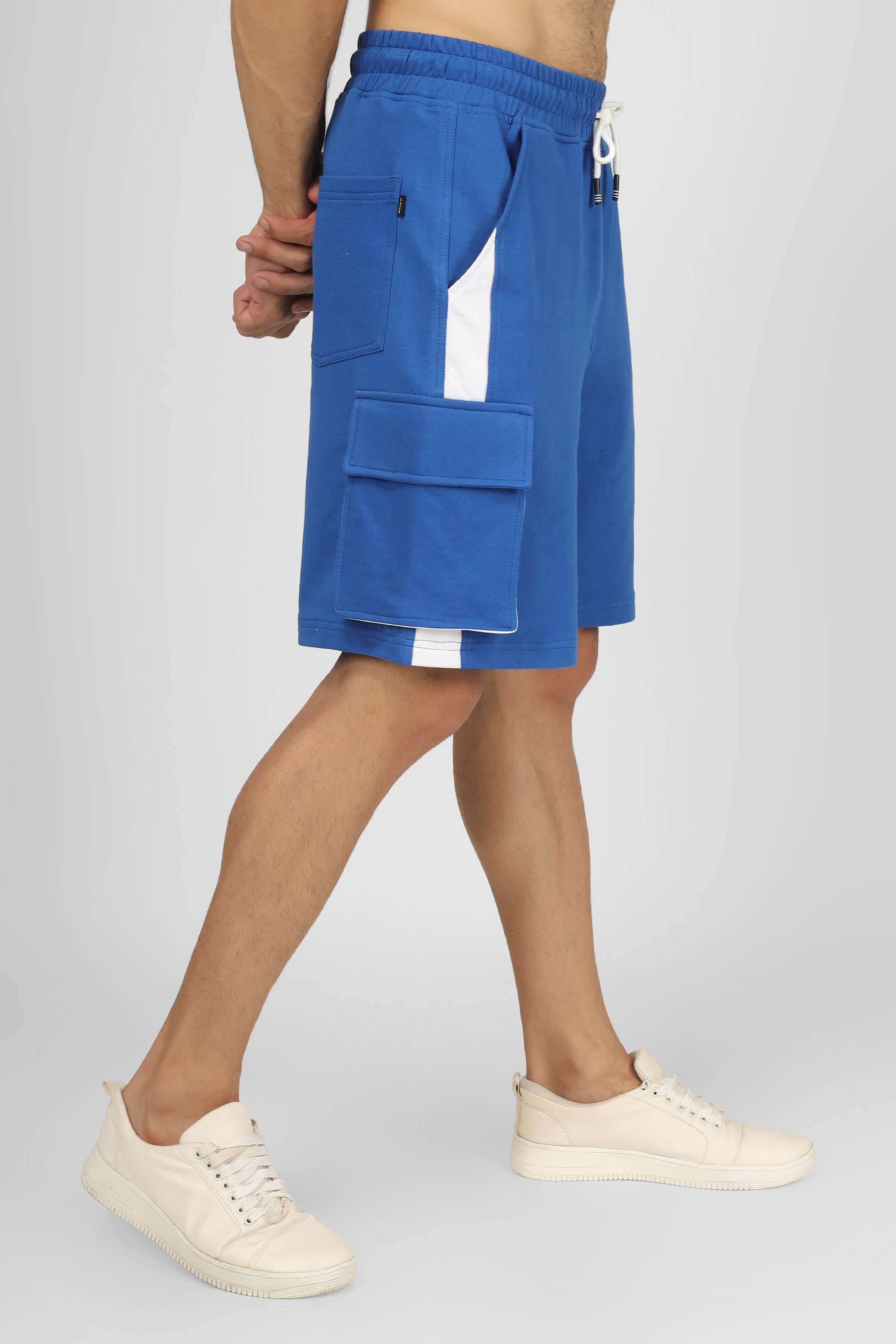 Model wearing Contra regular fit cargo shorts in royal blue and white with side pockets, highlighting custom fit option and stylish design.