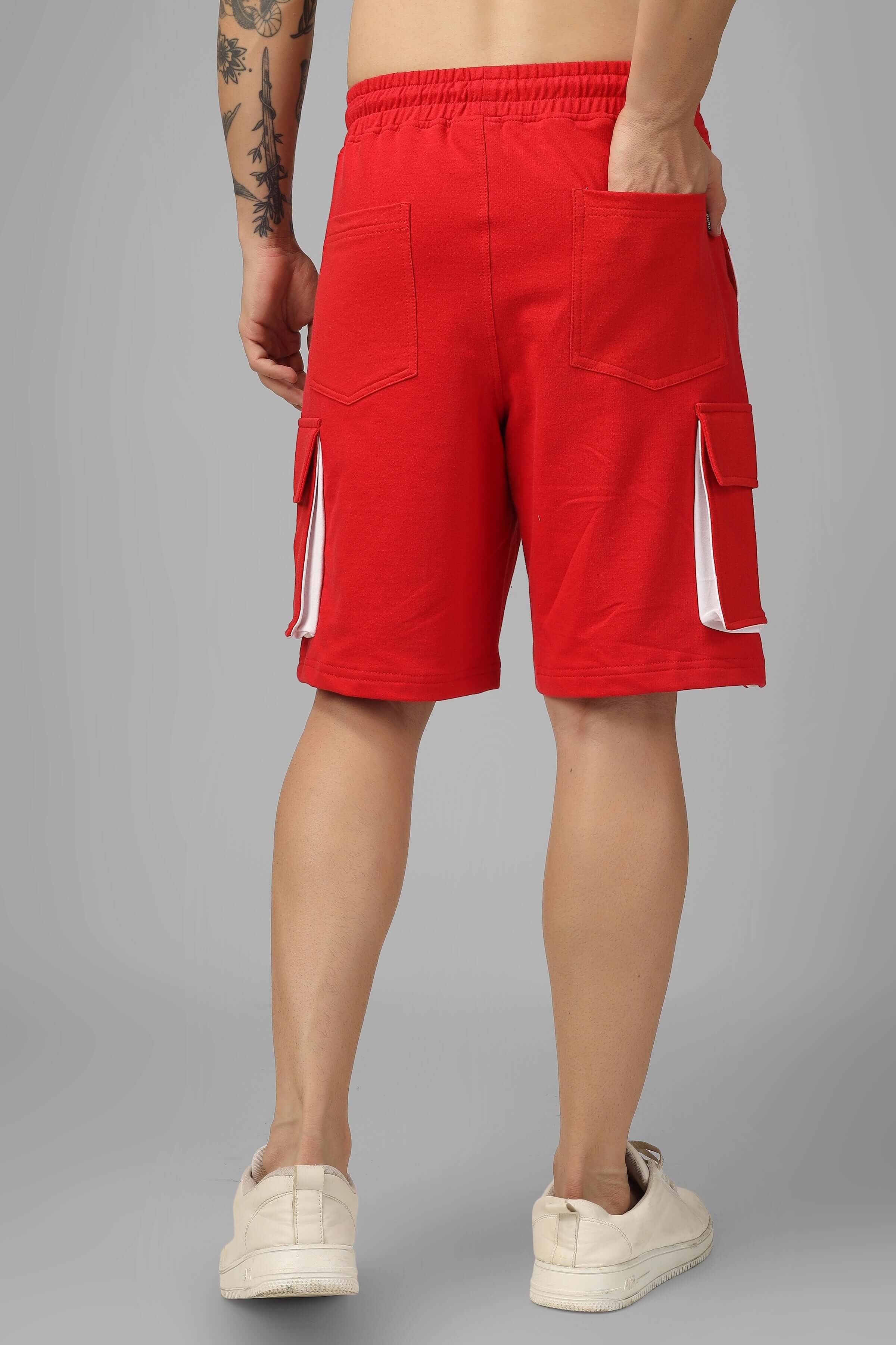 Rear view of man wearing CONTRA Regular Fit Cargo Shorts in red and white, showcasing side pockets and casual design.