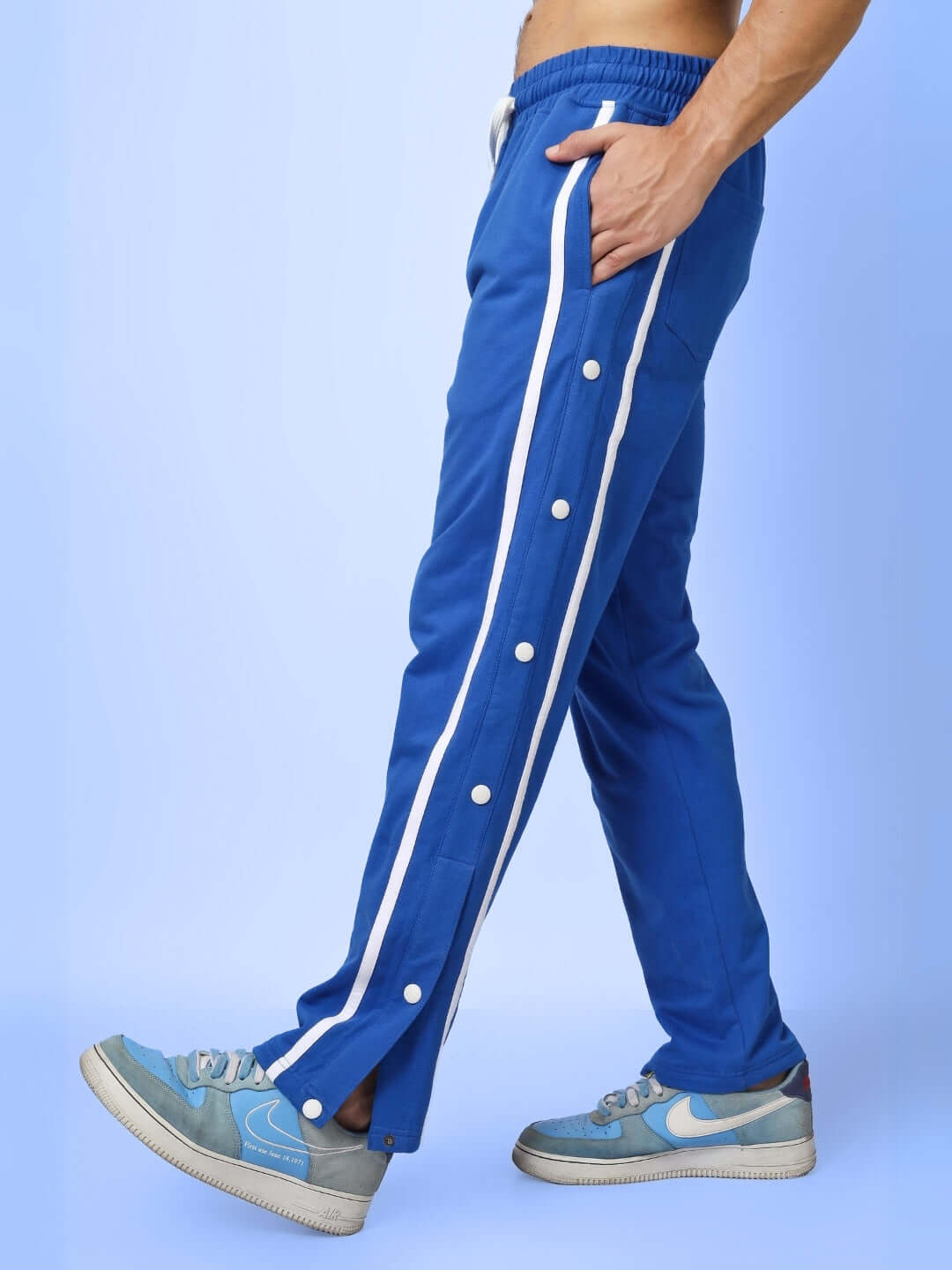 Blue contrast panel joggers from DUDS featuring white side stripes, designed for comfort and customizable fit options.
