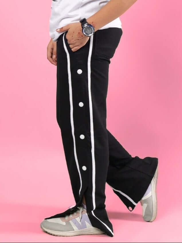 CONTRAST PANEL JOGGER FOR BOYS & GIRLS BLACK with button details on a pink background, showcasing sporty style for custom fit options