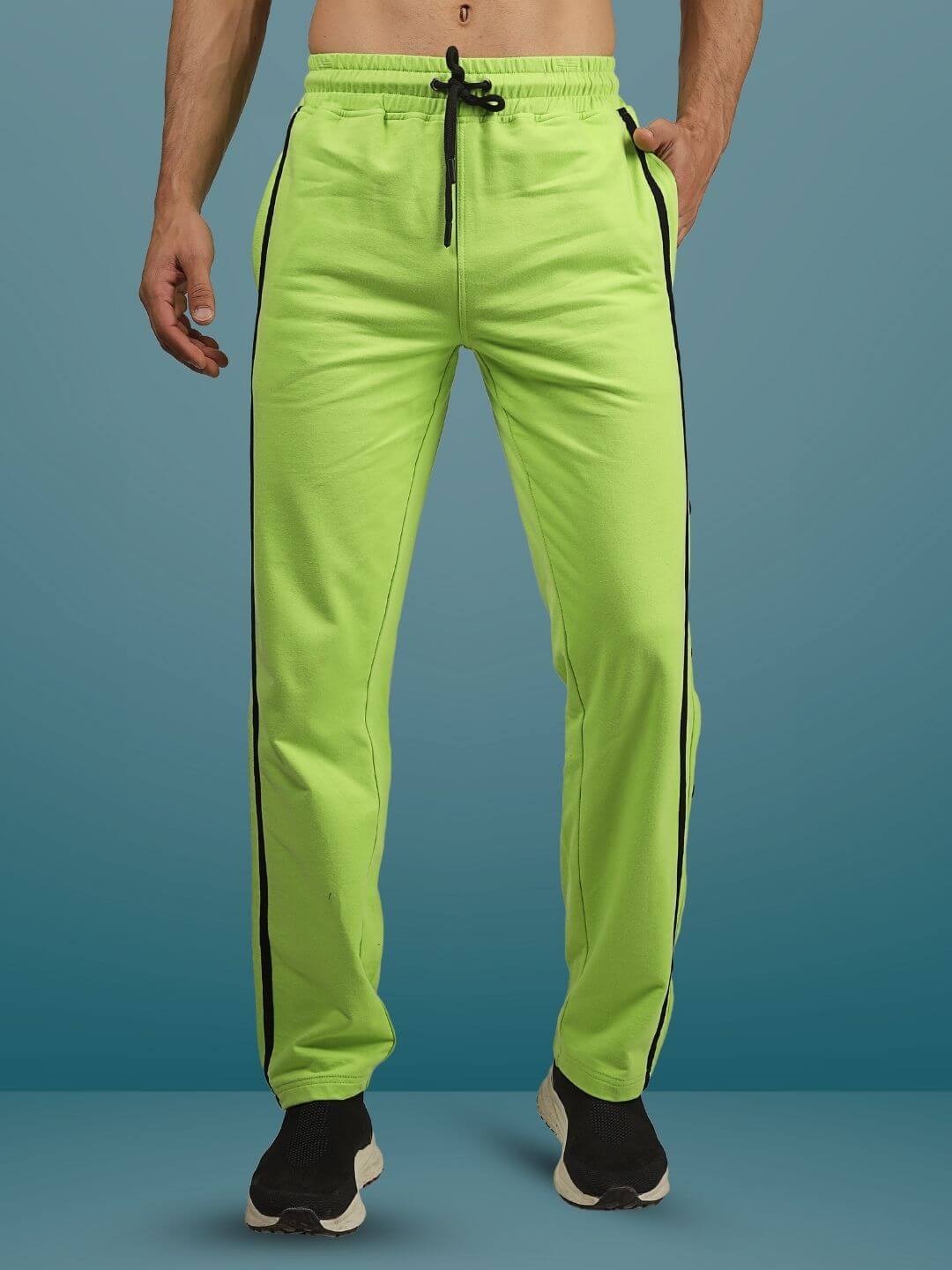 Neon green contrast panel joggers with black trim, customizable fit, made to order by DUDS tailors.
