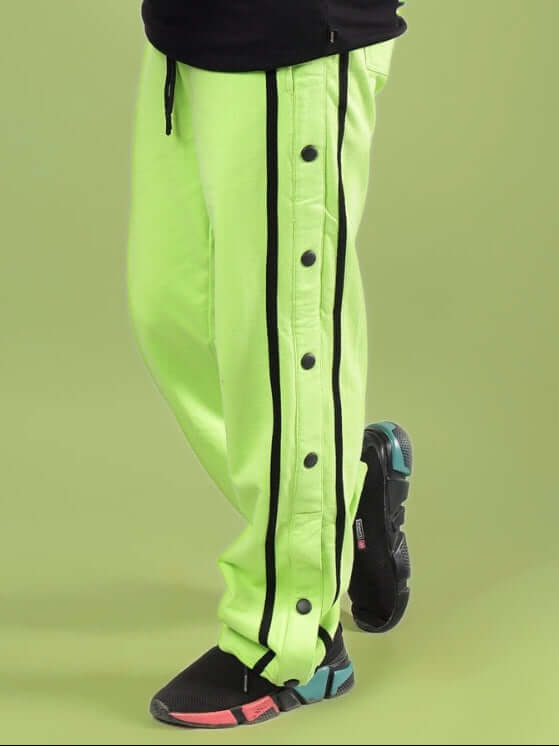 CONTRAST PANEL JOGGER FOR BOYS & GIRLS NEON GREEN with black stripe and button details for stylish kids' fashion.