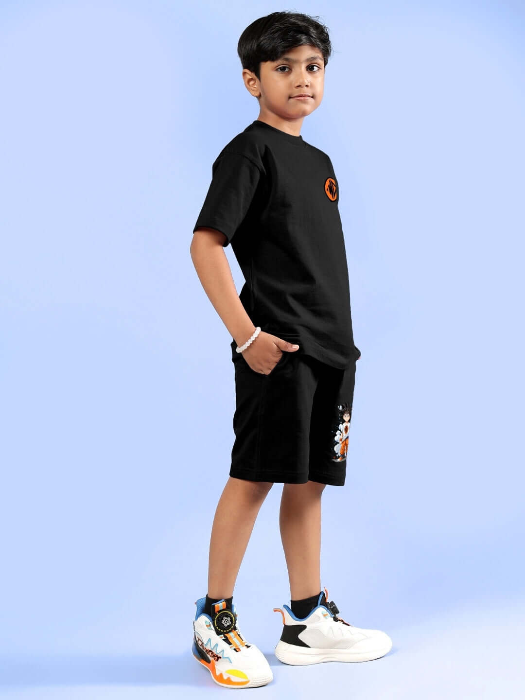 Child wearing COOL GOKU PRINTED CO-ORD FOR BOYS & GIRLS BLACK, featuring a Goku-printed t-shirt and shorts.